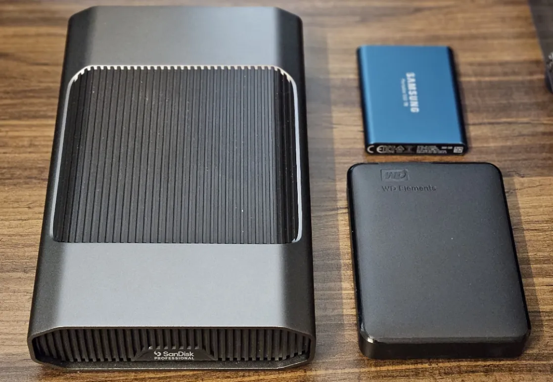Size compared to 4TB WD HDD and Samsung T5 SSD.