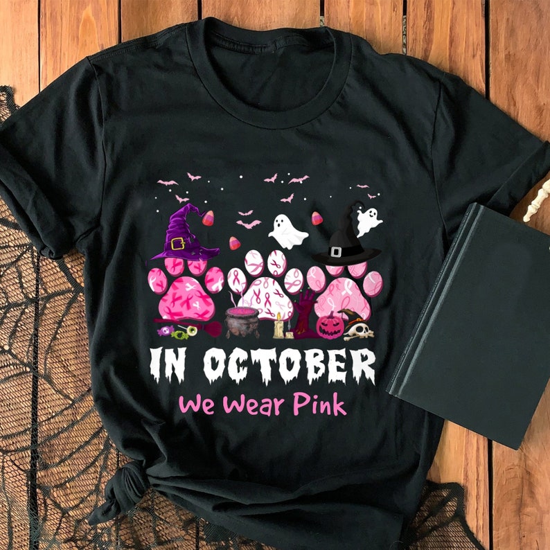 In October We Wear Pink Paw Prints Shirt, Pink Paws Breast Cancer Awareness Shirt, Dog Halloween Breast Cancer Awareness Month Gift