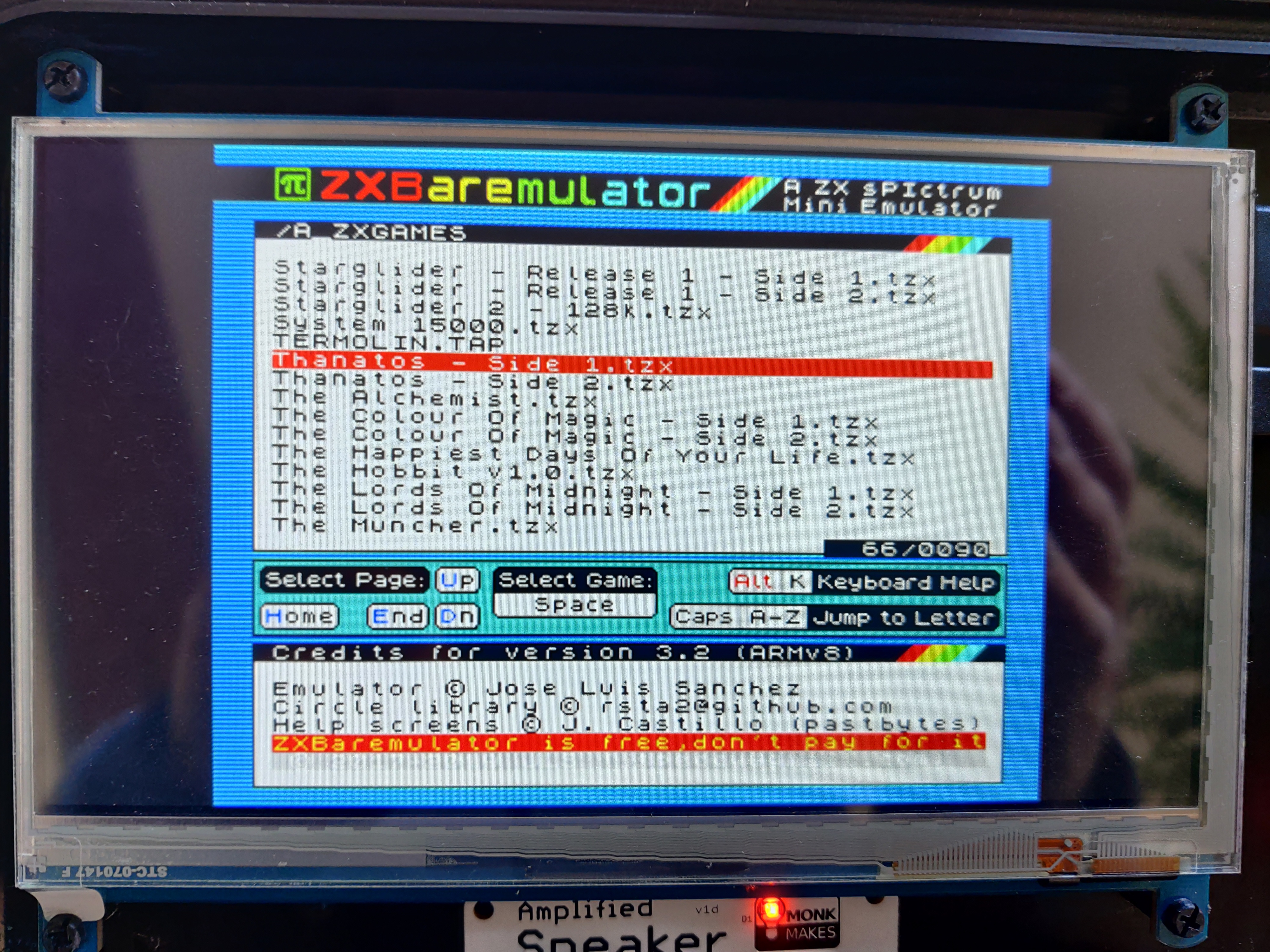 The above-mentioned tape selection screen. It has the ZXBareEmulator logo at the top followed by a list of files from the SD card. The currently selected file is "Thanatos Side 1.tzx"
