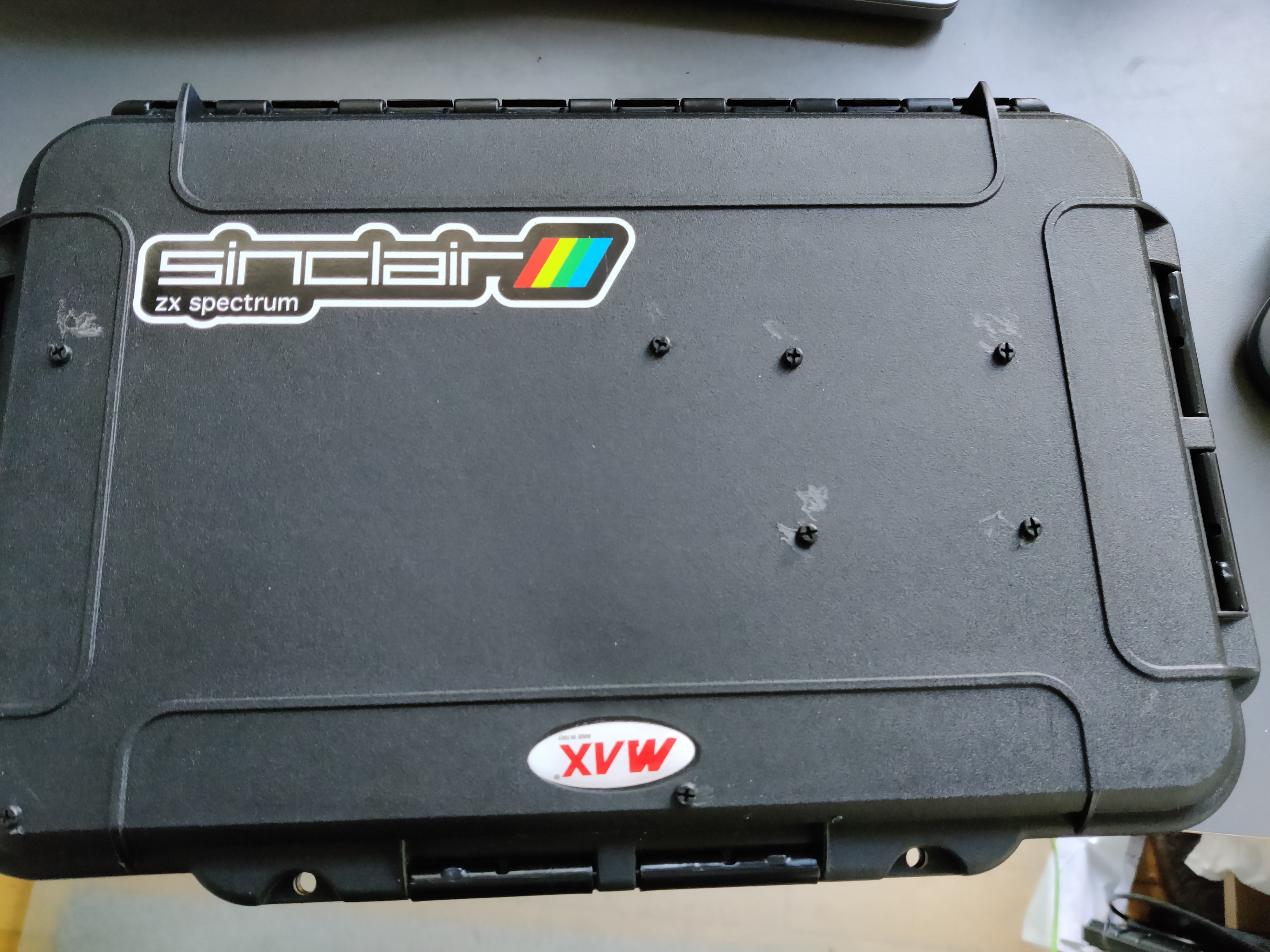 The case, closed, with a third-party "Sinclair ZX Spectrum" sticker on it
