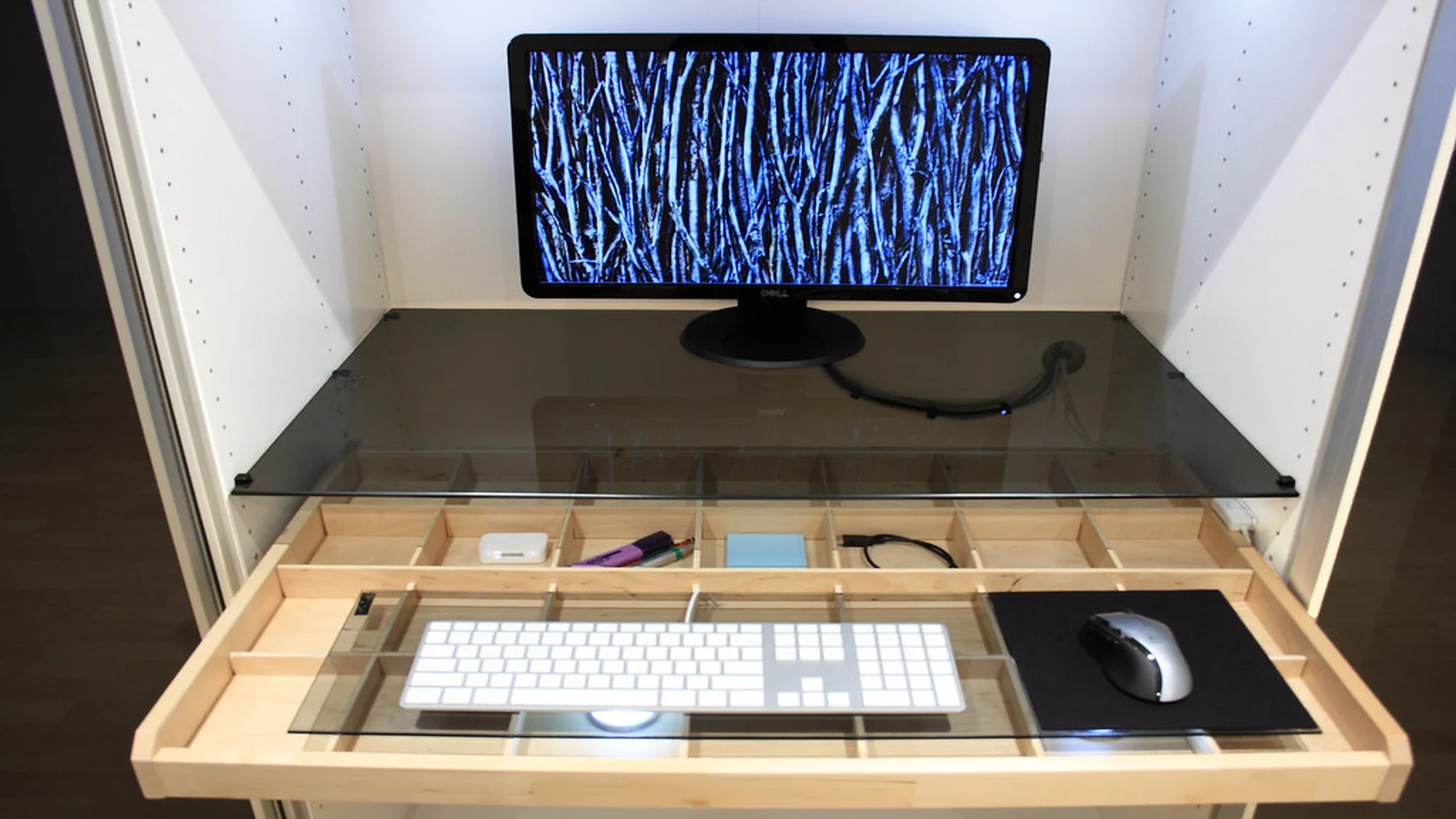 Open office articulating keyboard arm and cable planning workspace