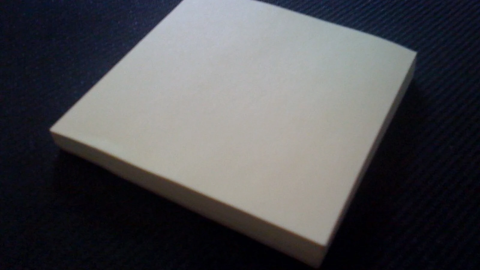 Sticky notes and office supplies arranged in a tidy desk organizer context