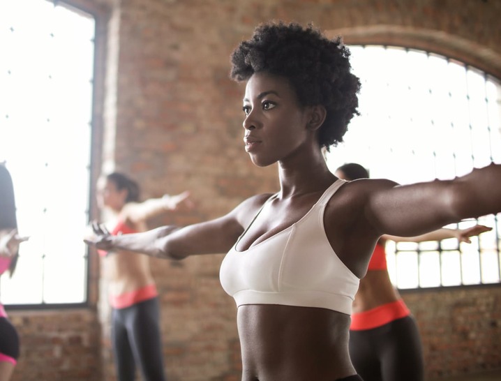 Woman working out with toned arms and stomach