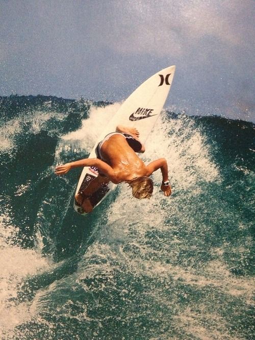 Surfer riding a wave on a surfboard …
