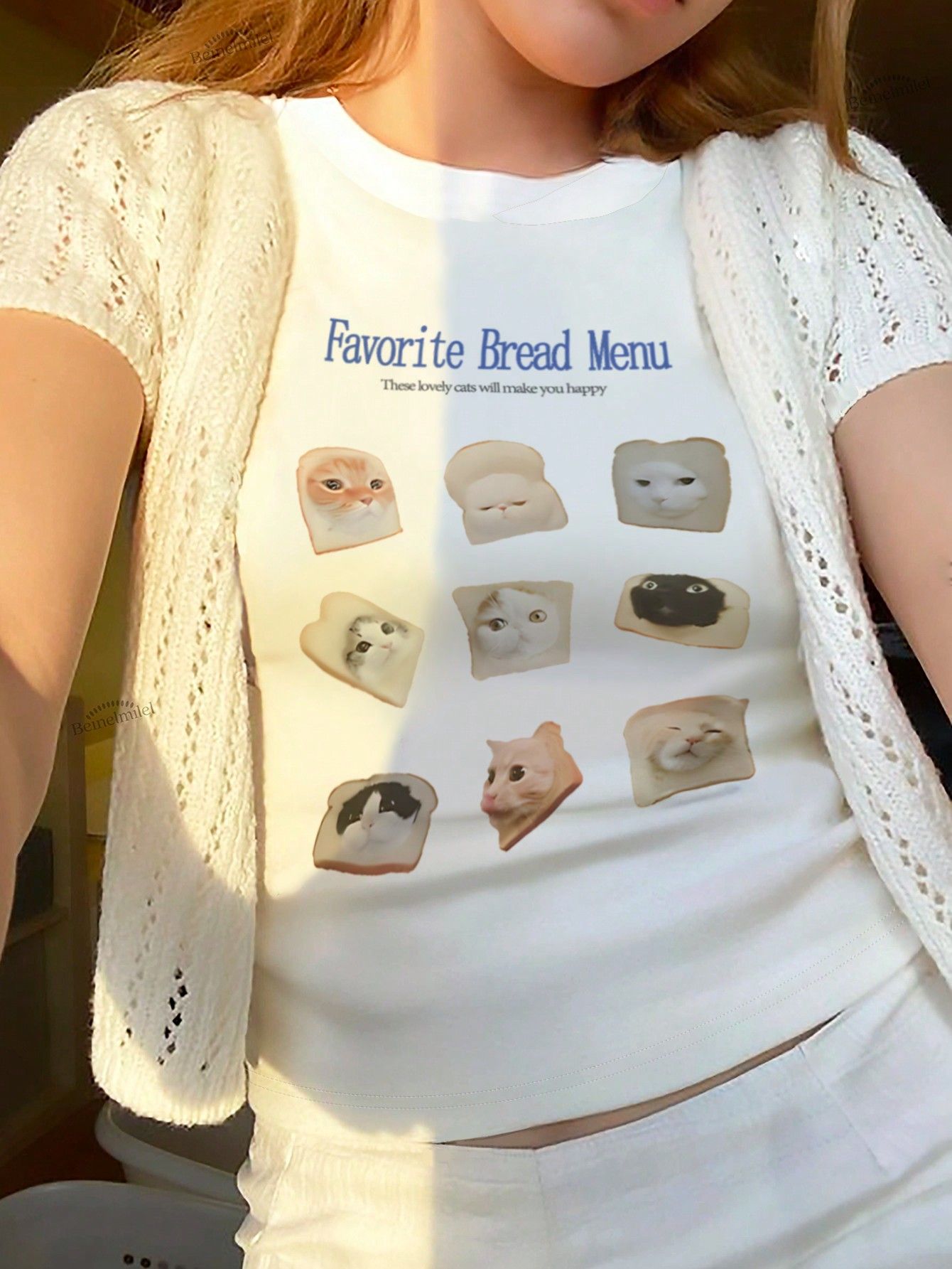 cream-colored crop T-shirt features  &hellip;
