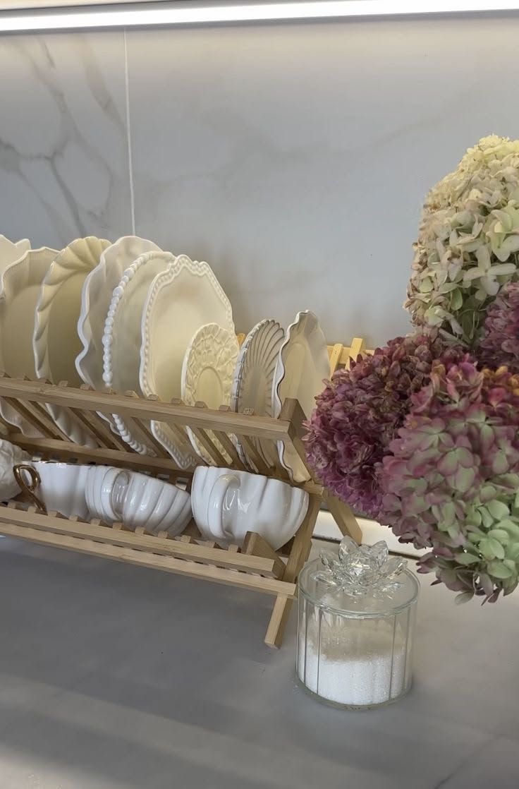 Floral Table Setting with Dinnerware and Decorative Vases
