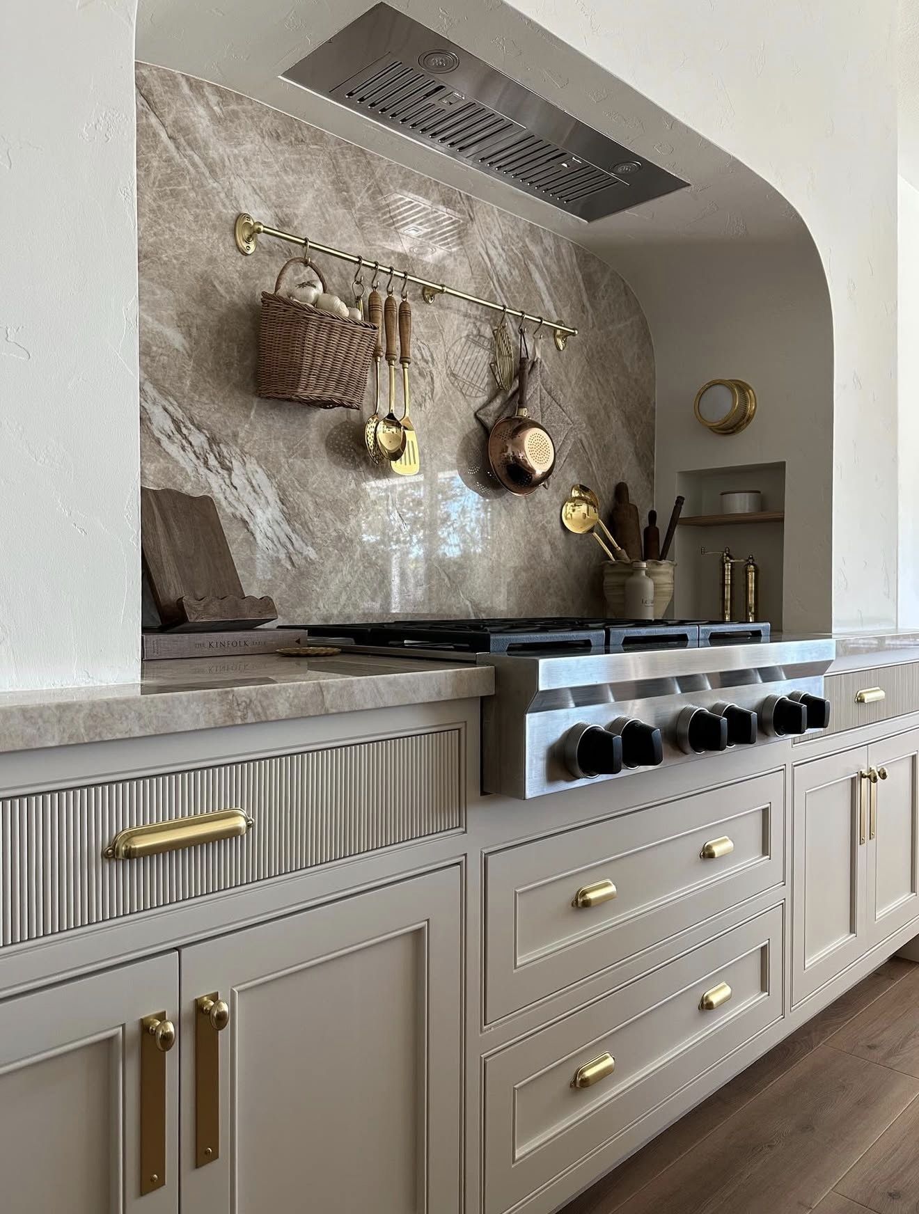 Hanging Pot and Pan Storage in a White Kitchen