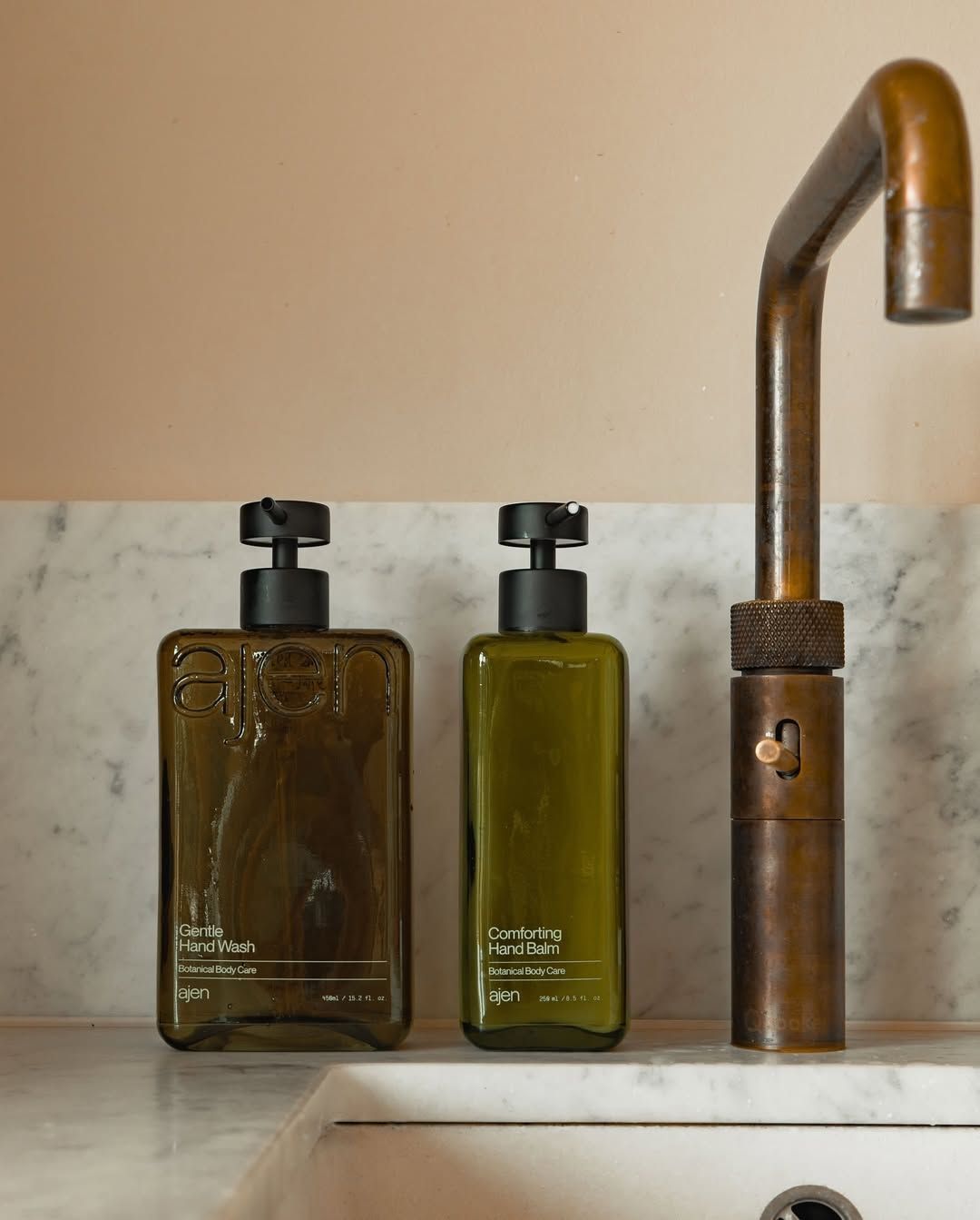 Soap Dispenser Set on a Marble Bathroom Counter