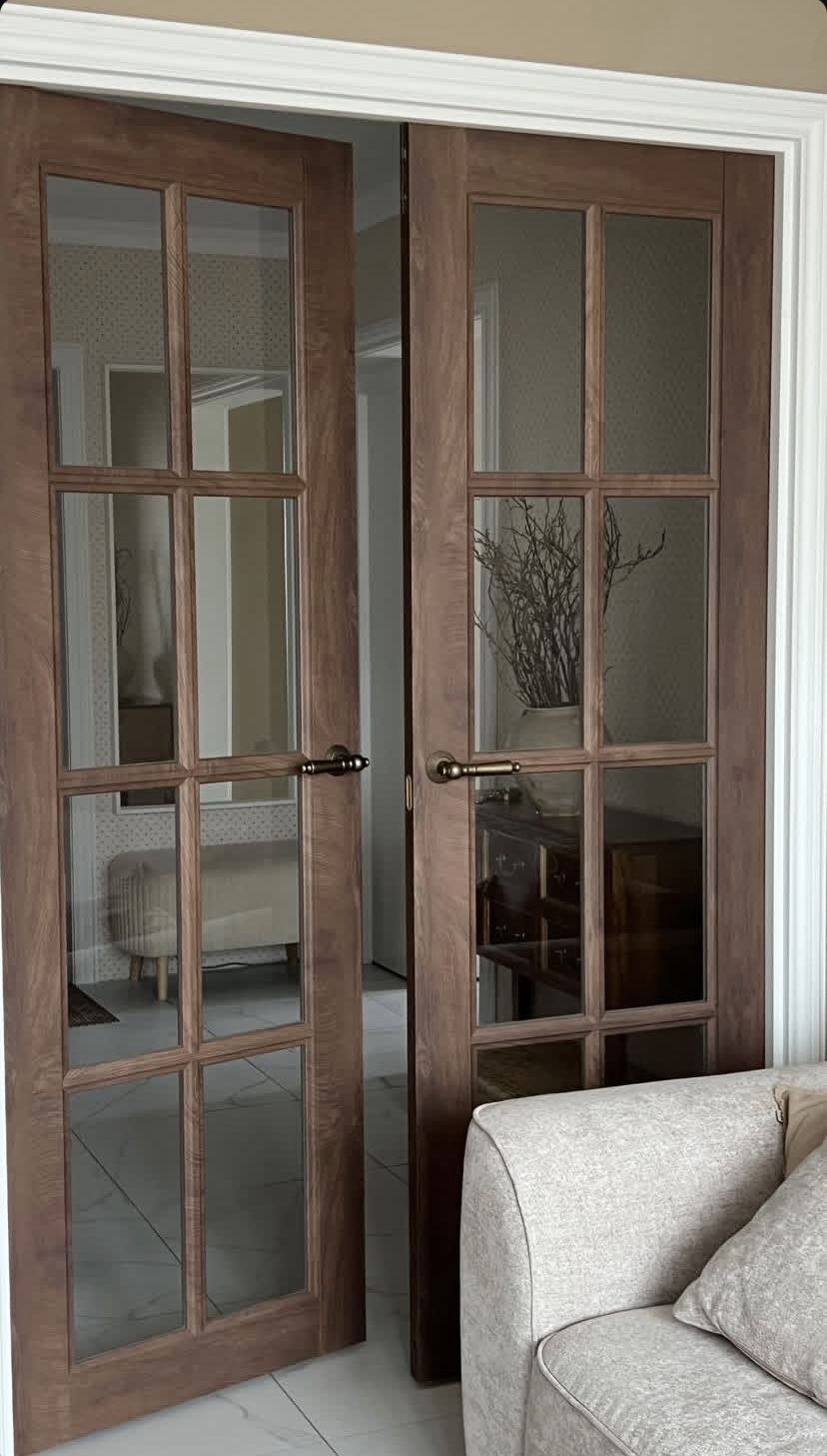 Living Room Sofa beside Glass-Pane Doors