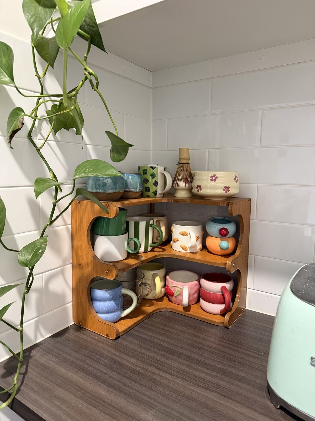 Cup and Saucer Set on a Wooden Kitchen Shelf