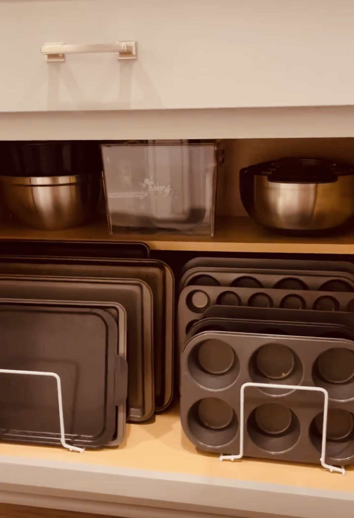 Organized Kitchen Shelf with Pots and Pans