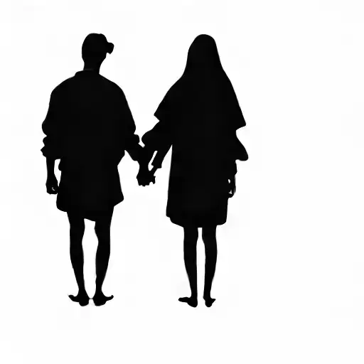 Two People Holding Hands In The Dark