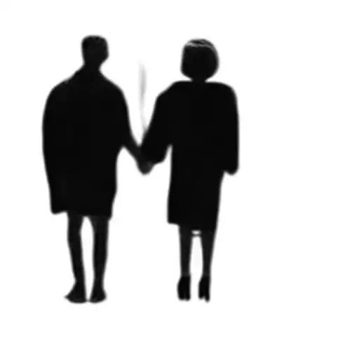 Two People Holding Hands In The Dark