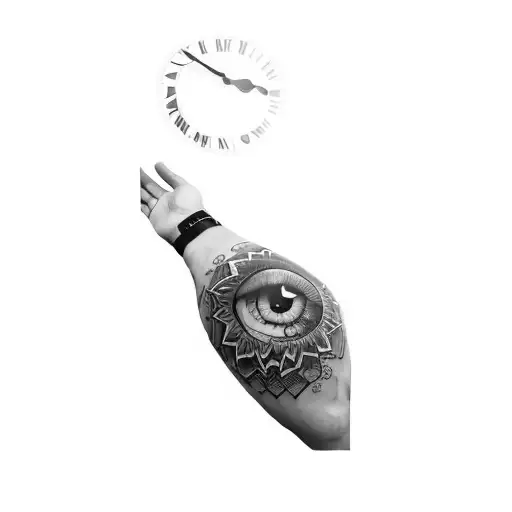 A Man's Arm With A Tattoo Of An Eye And A Clock