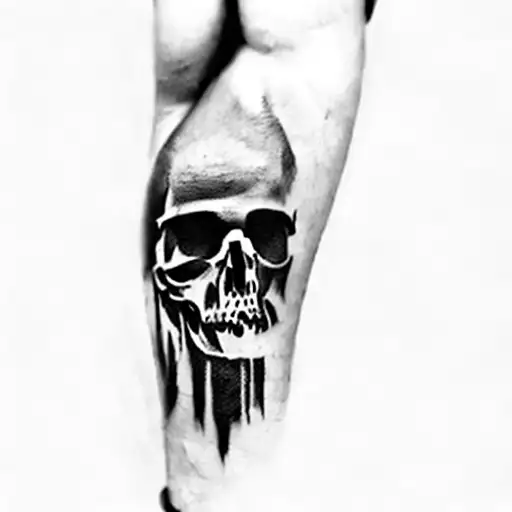 A Man With A Skull Tattoo On His Arm