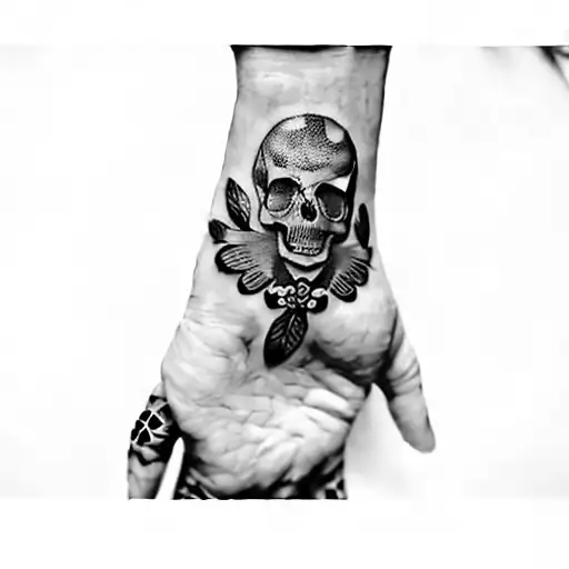 A Hand With A Skull And Butterflies