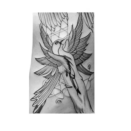 A Tattoo Of A Bird With Wings