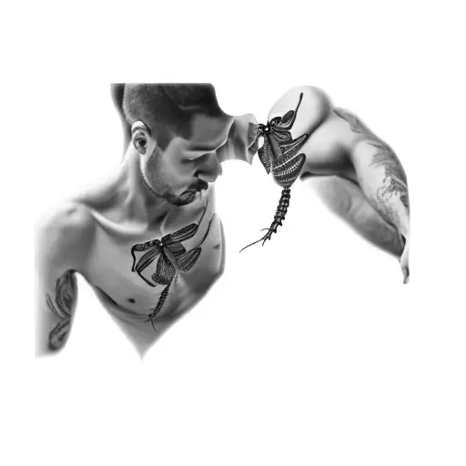 A Man With A Dragonfly Tattoo On His Chest