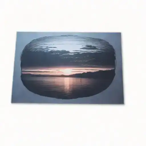 A Sunset Over A Body Of Water