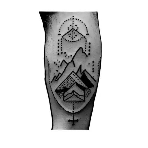 A Man's Leg With A Tattoo Of A Car And Mountains