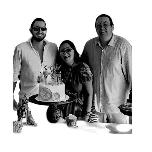 A Group Of People Posing In Front Of A Cake