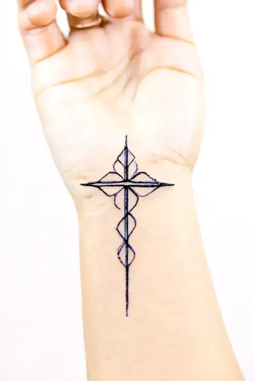 Cross Strength Feminine Wrist Tattoo Design