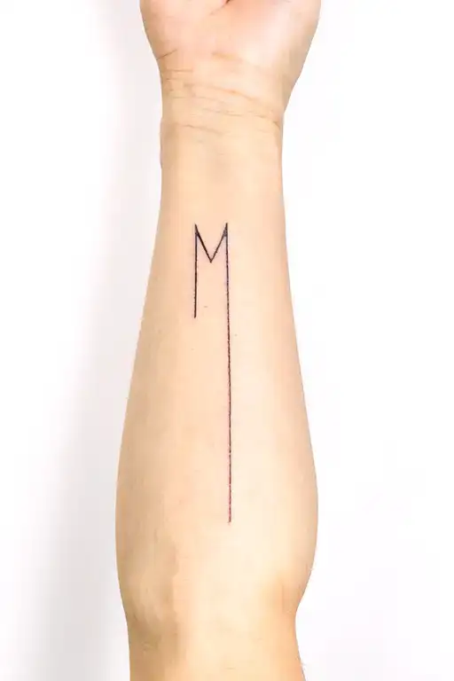Minimal -Style Forearm Tattoo With M - D