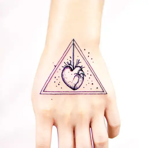 Natural Looking Breathing Heart On Woman Hand In A Triangle