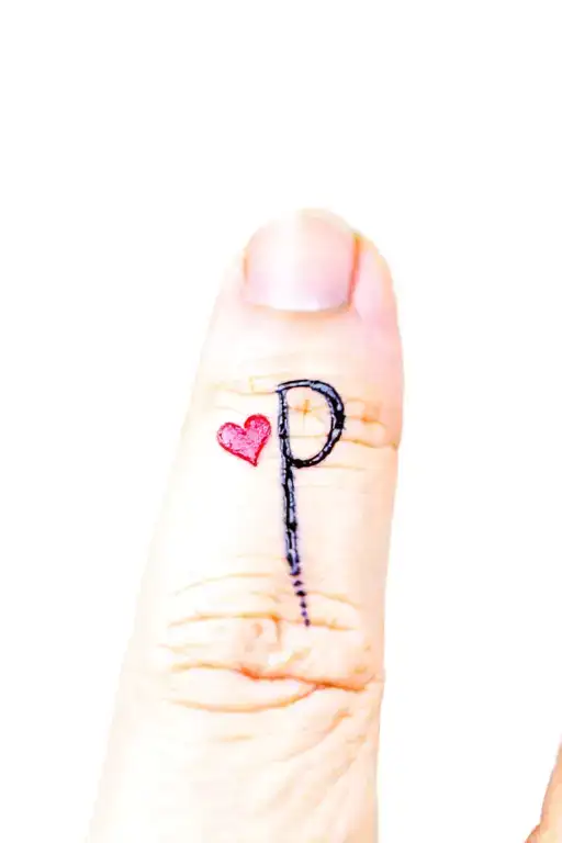 P Initial Tattoo On Ring Finger Fancy Writing And Little Heart Next To It