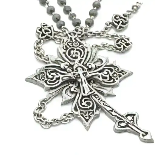 Rosary Cross Necklace Hanging Off Soemthing