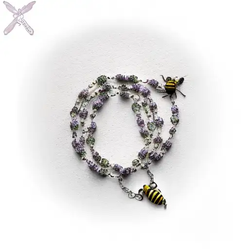 Rosary Necklace With A Crape Myrtle Tree In The Backround With A Bee On It